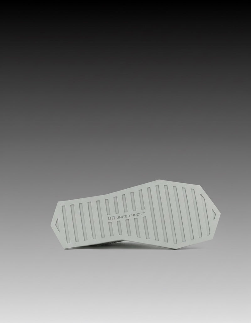 sandalia plana geométrica flexible y minimalista para mujer