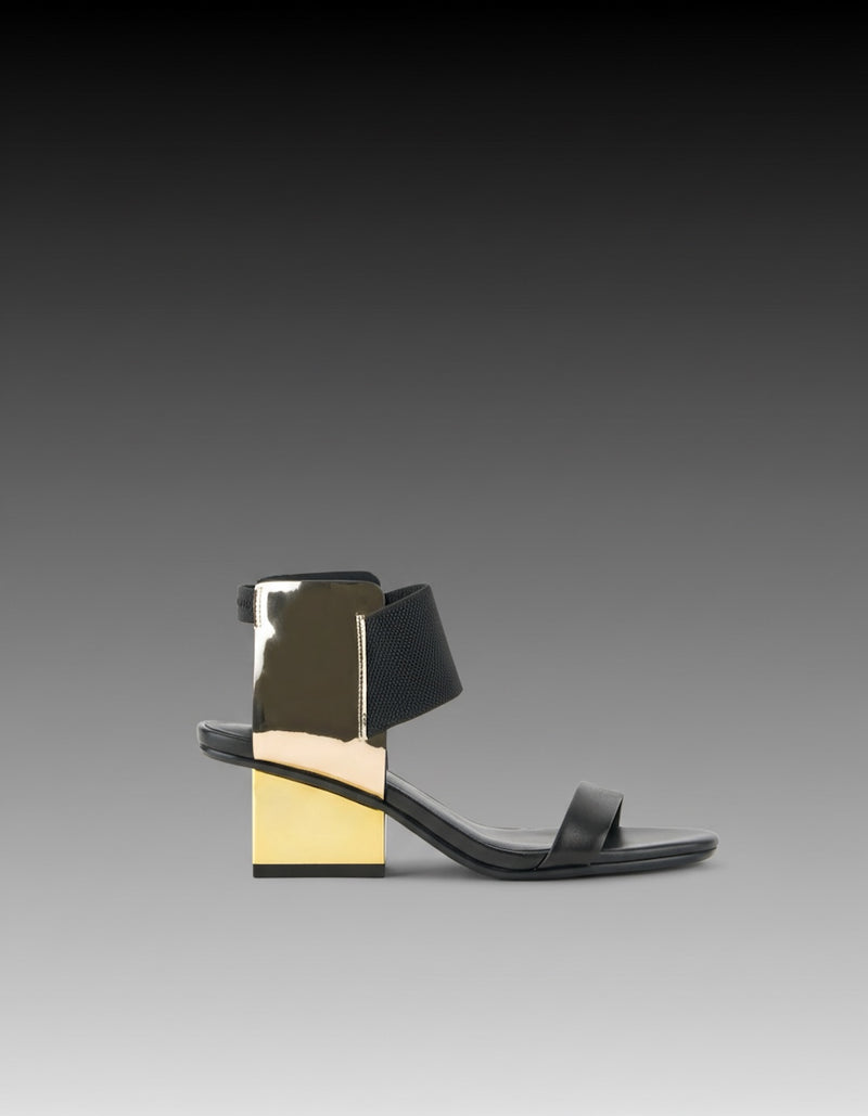 sandalias tacón bajo de cuero negro y detalles en dorado para mujer